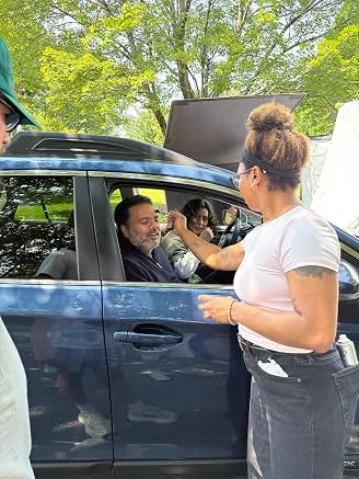 Sunil filming a scene in a car