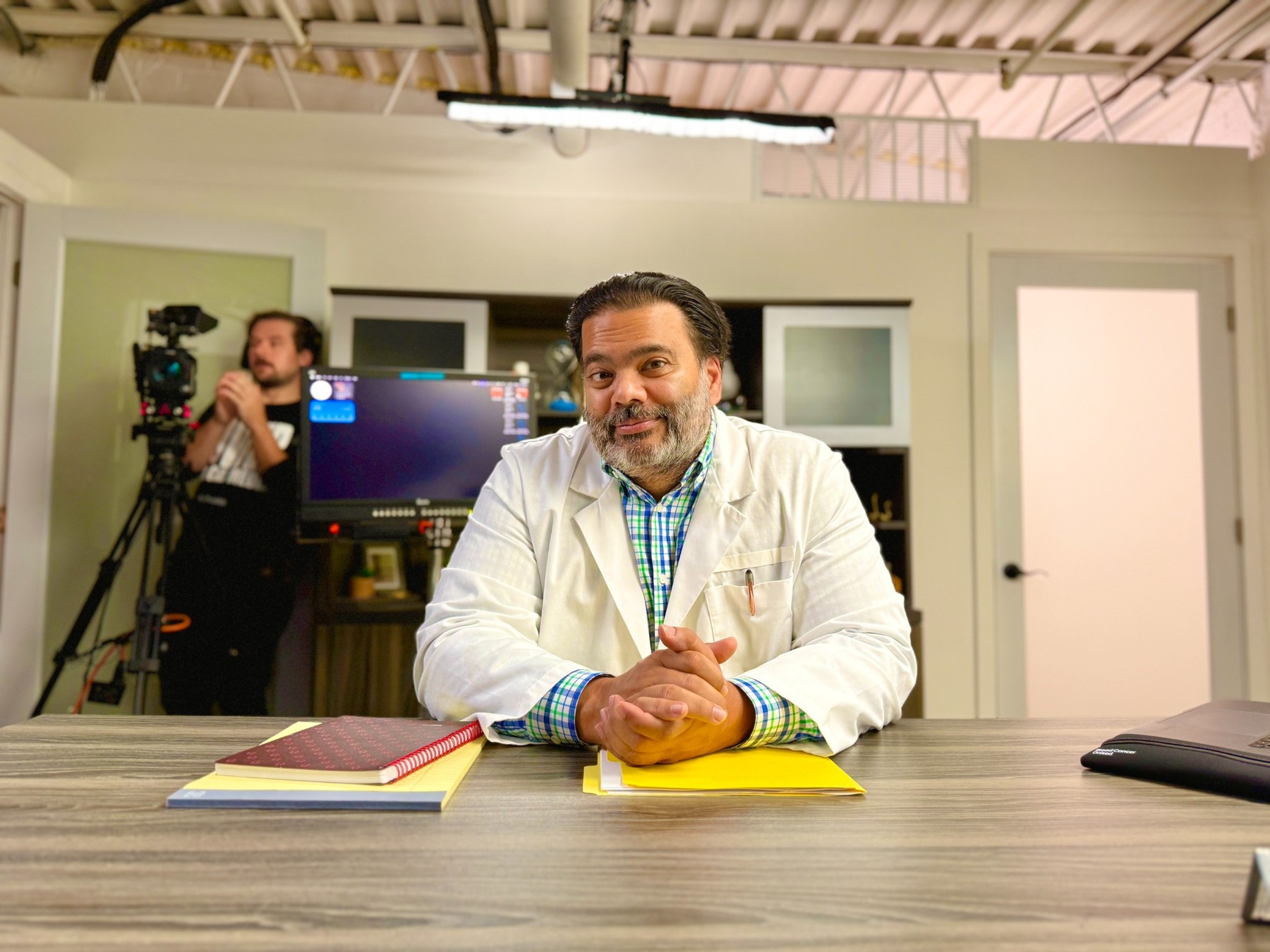 Sunil as a physician on a studio set