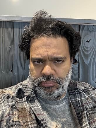 Sunil in character with a gray beard