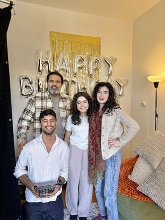 Cast members together on set