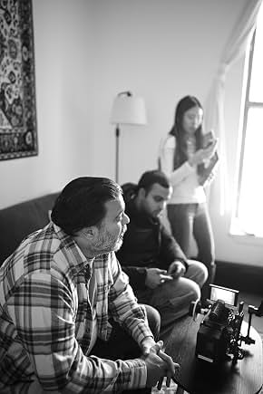 Behind the scenes with cast members in black and white