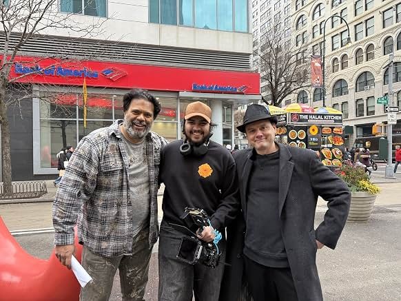 Sunil with fellow cast members outside a theater