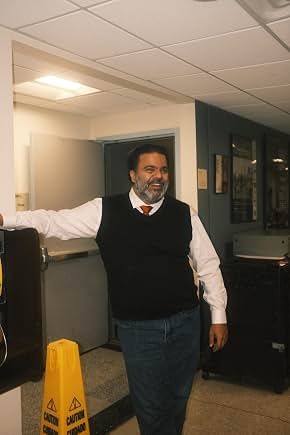 Sunil in character wearing a waistcoat