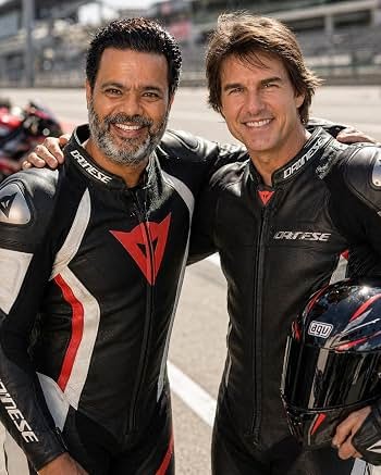 Sunil with a fellow performer in racing costumes