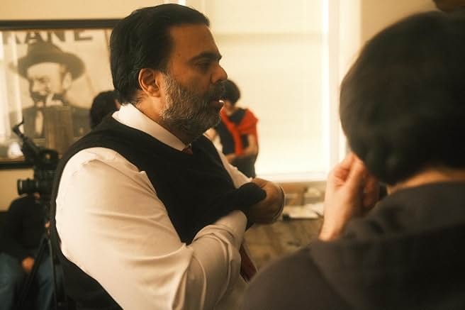 Sunil performing a scene in a waistcoat
