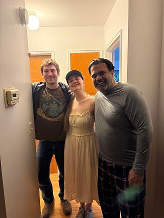 Sunil with fellow performers on an interior set