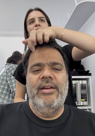 Sunil preparing for a scene with a makeup artist