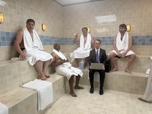 Sunil with fellow performers in robes on set