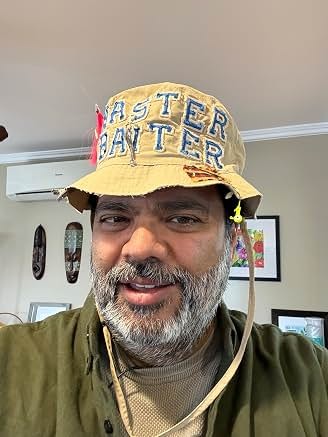 Sunil in costume wearing a hat