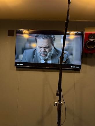 Production monitor showing Sunil in a scene