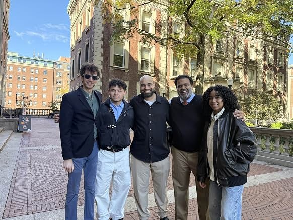 Sunil with cast members outdoors